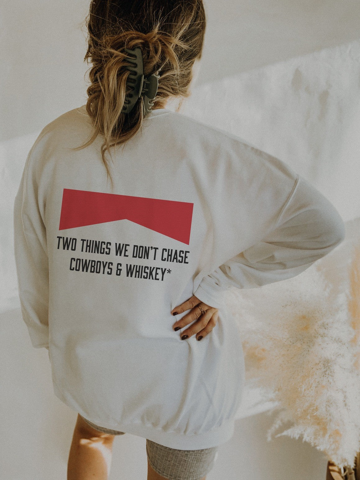 Two Things We Don't Chase Cowboys & Whiskey* Unisex fleece sweatshirt